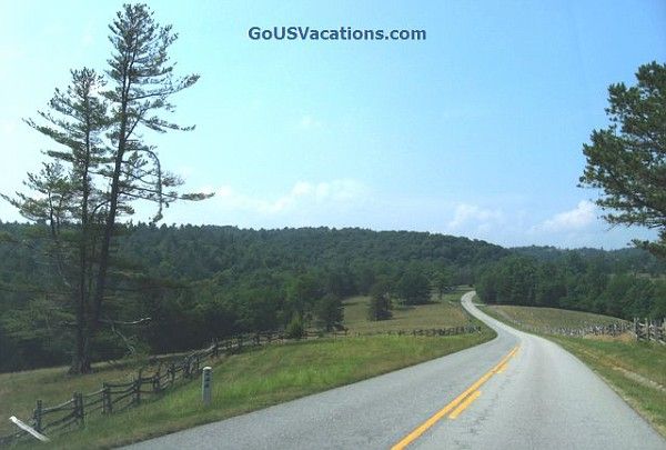 Peaceful drive through an area with split rail fences on Blue Ridge Parkway in Virginia